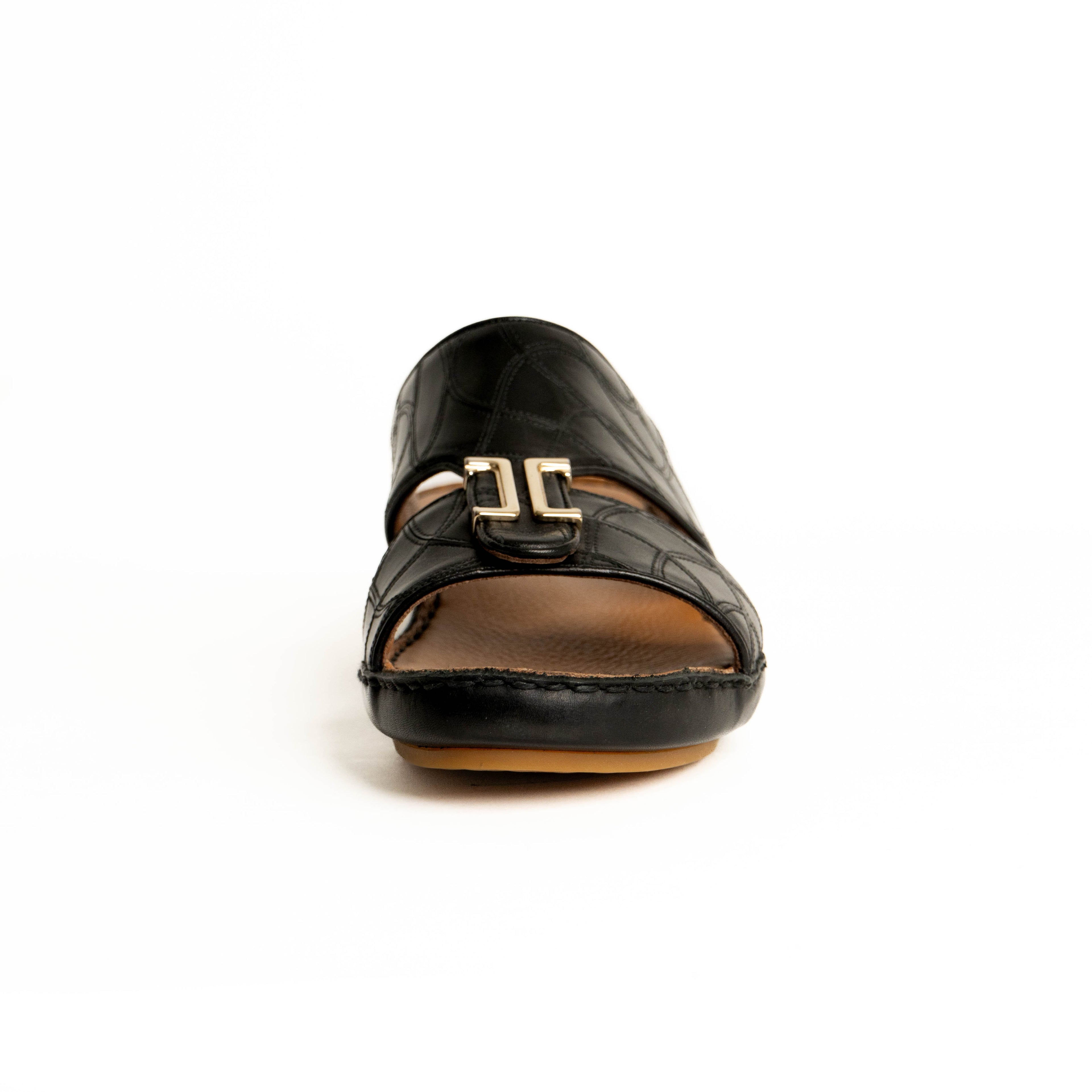 Black sandal with a gold buckle on a white background