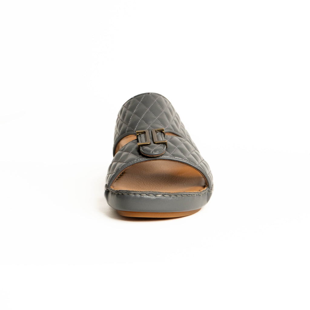 Gray quilted sandal with a brown insole on a white background