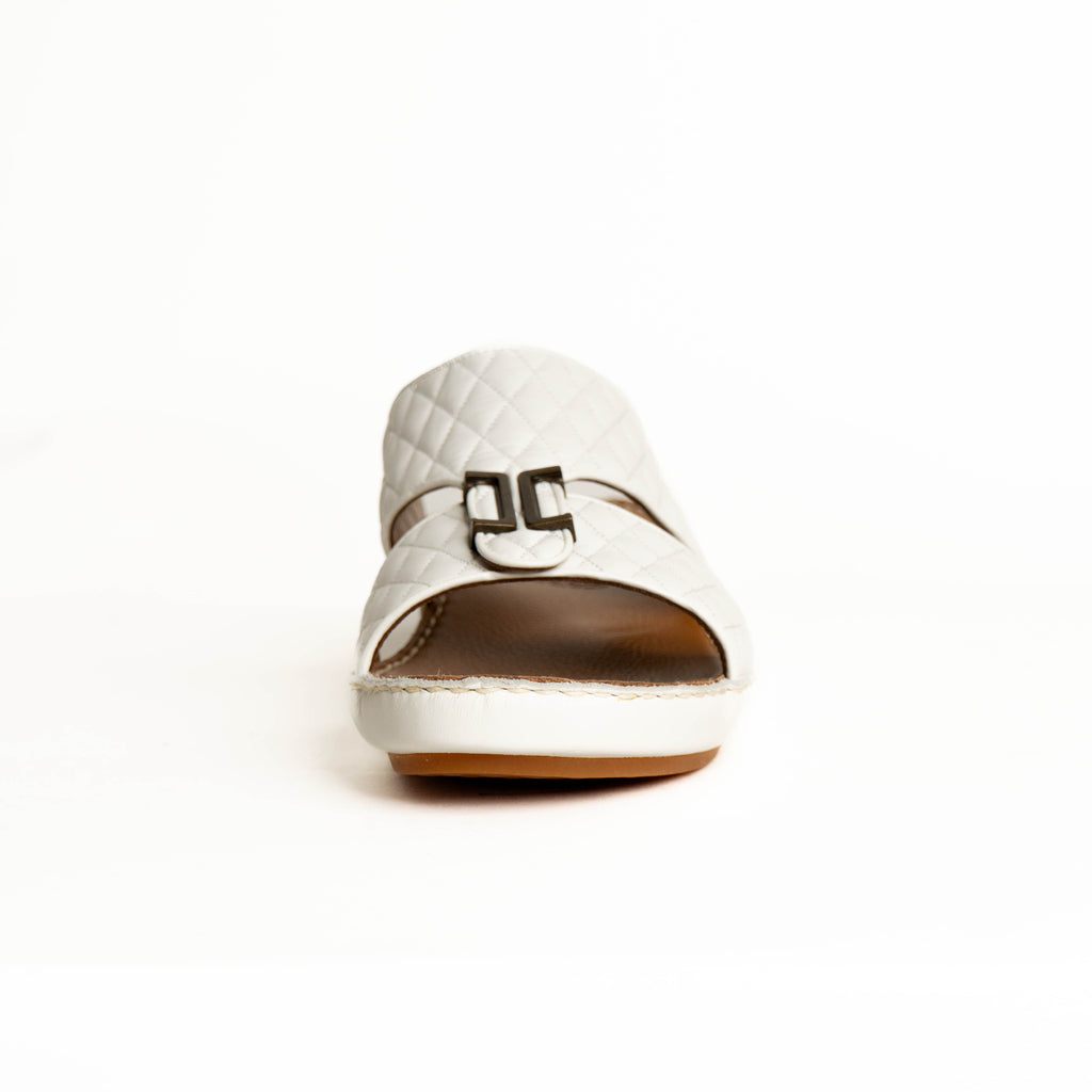 White shoe with a brown sole on a white background