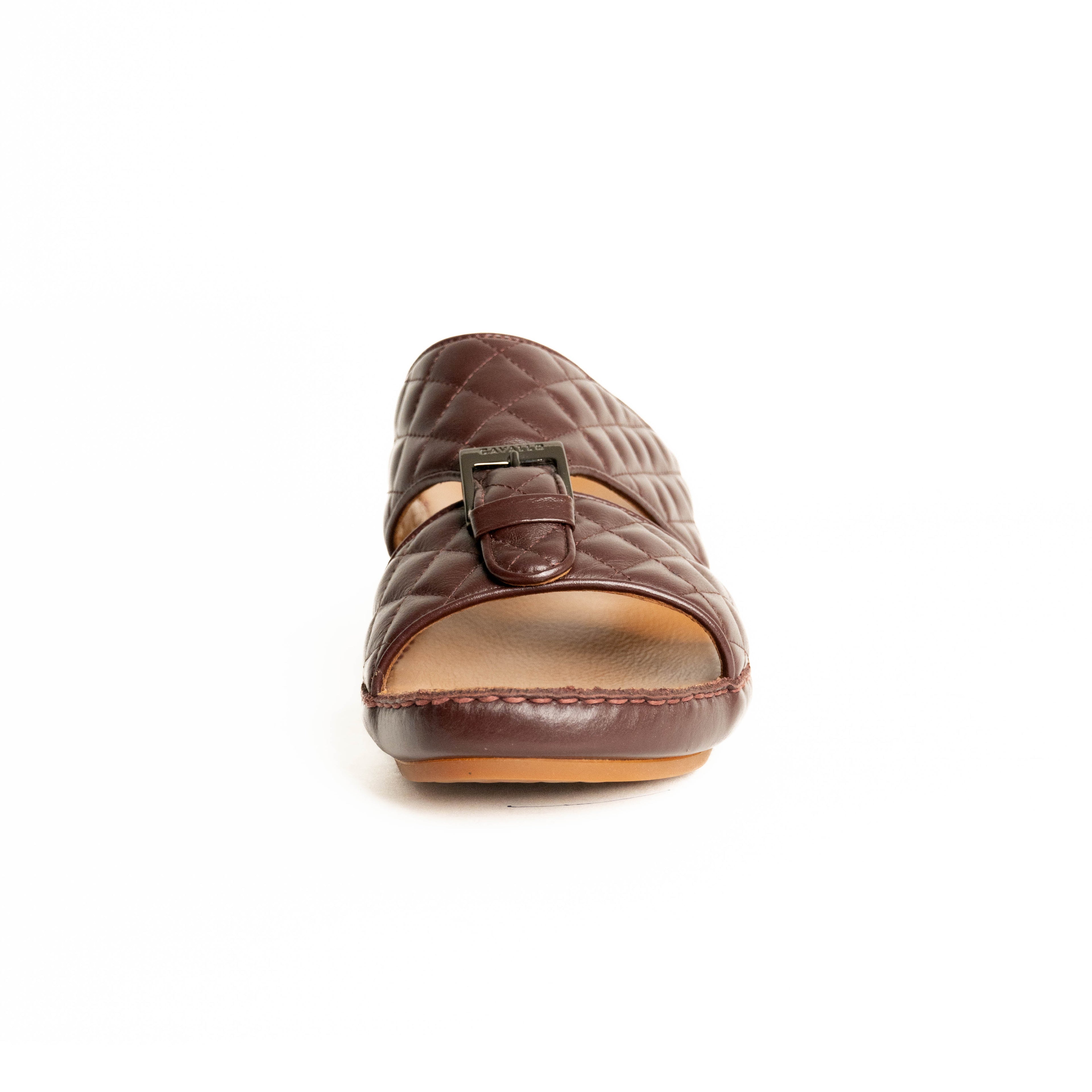 Brown quilted sandal with a buckle on a white background