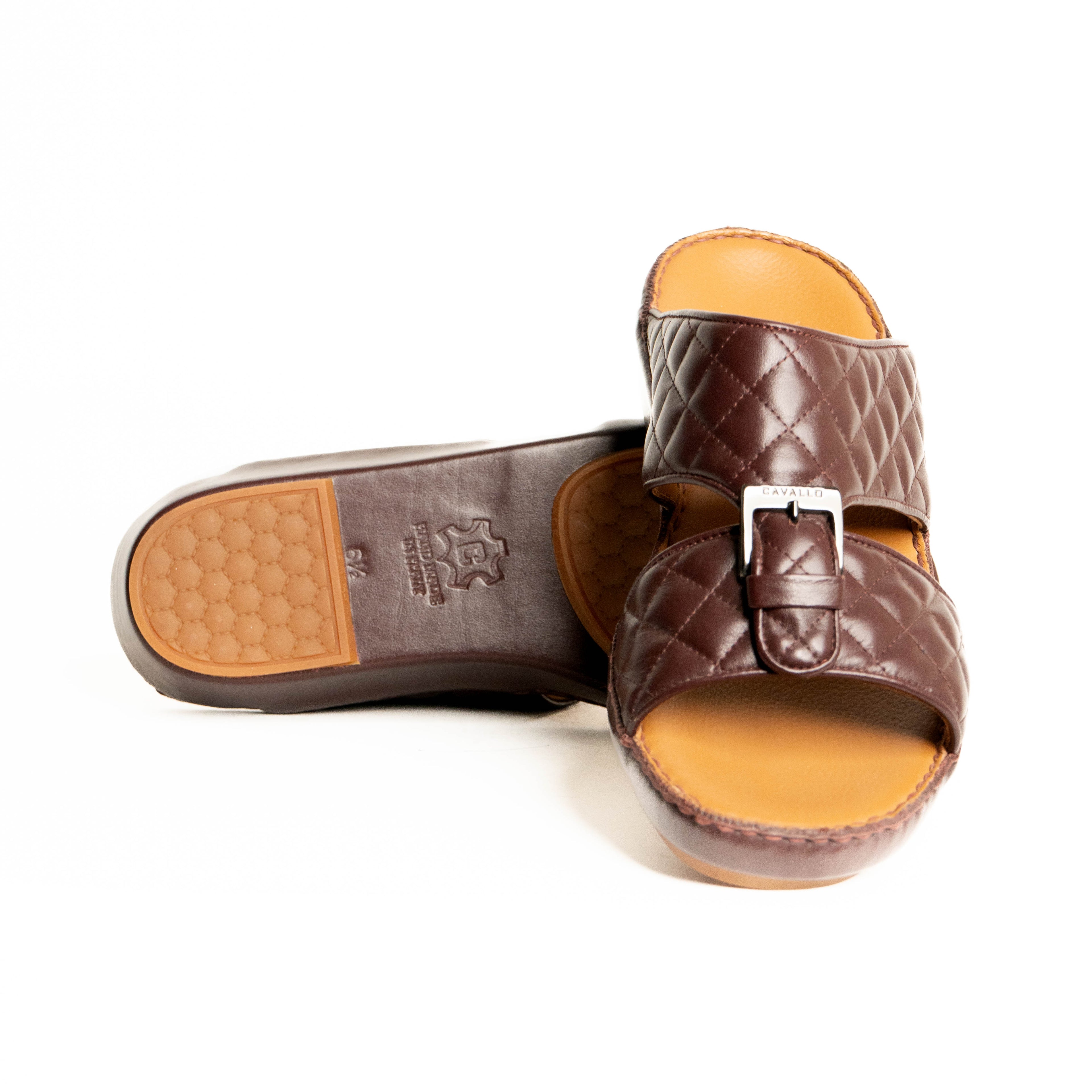 Brown quilted sandal with tan insole on a white background