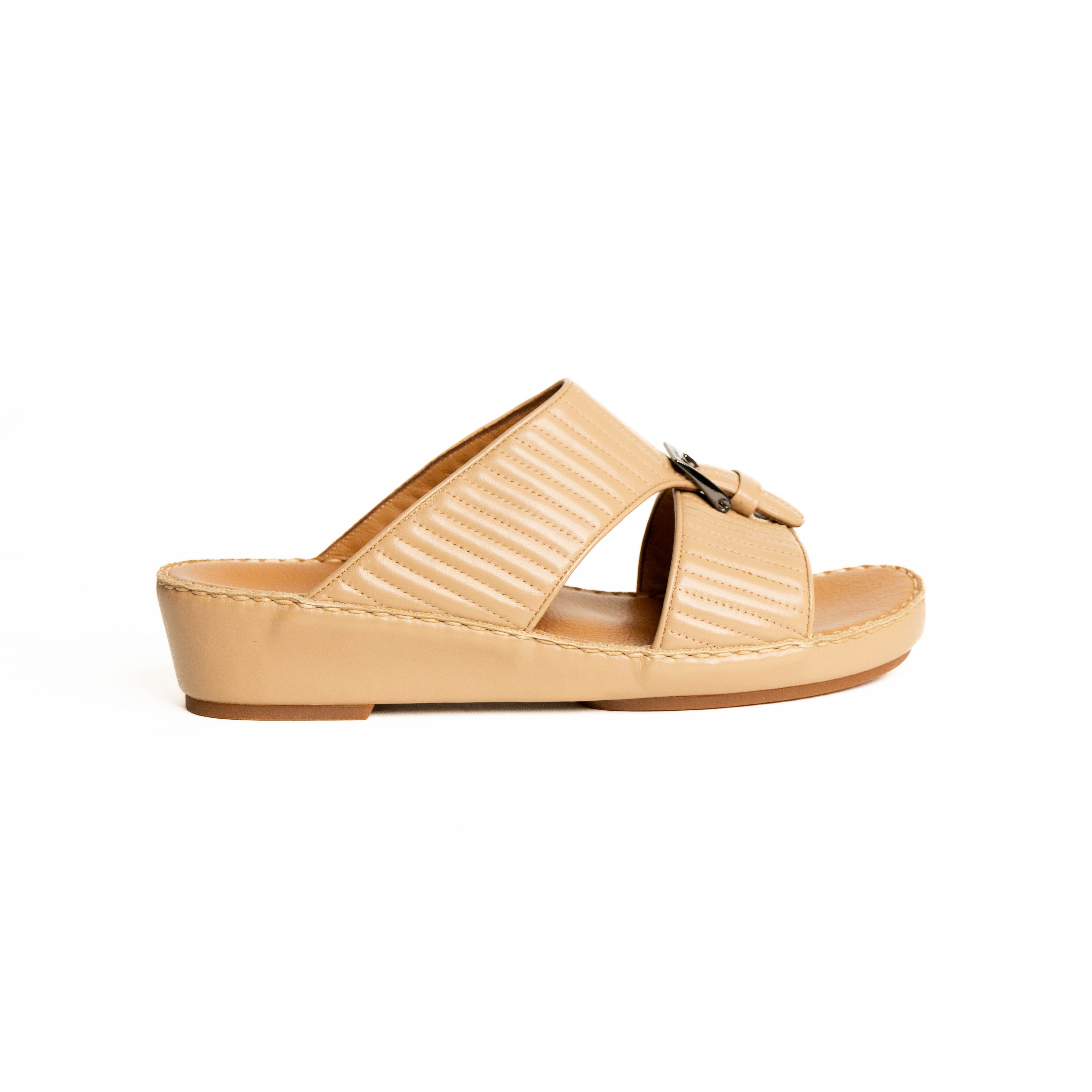 Beige sandal with a strap on a white background