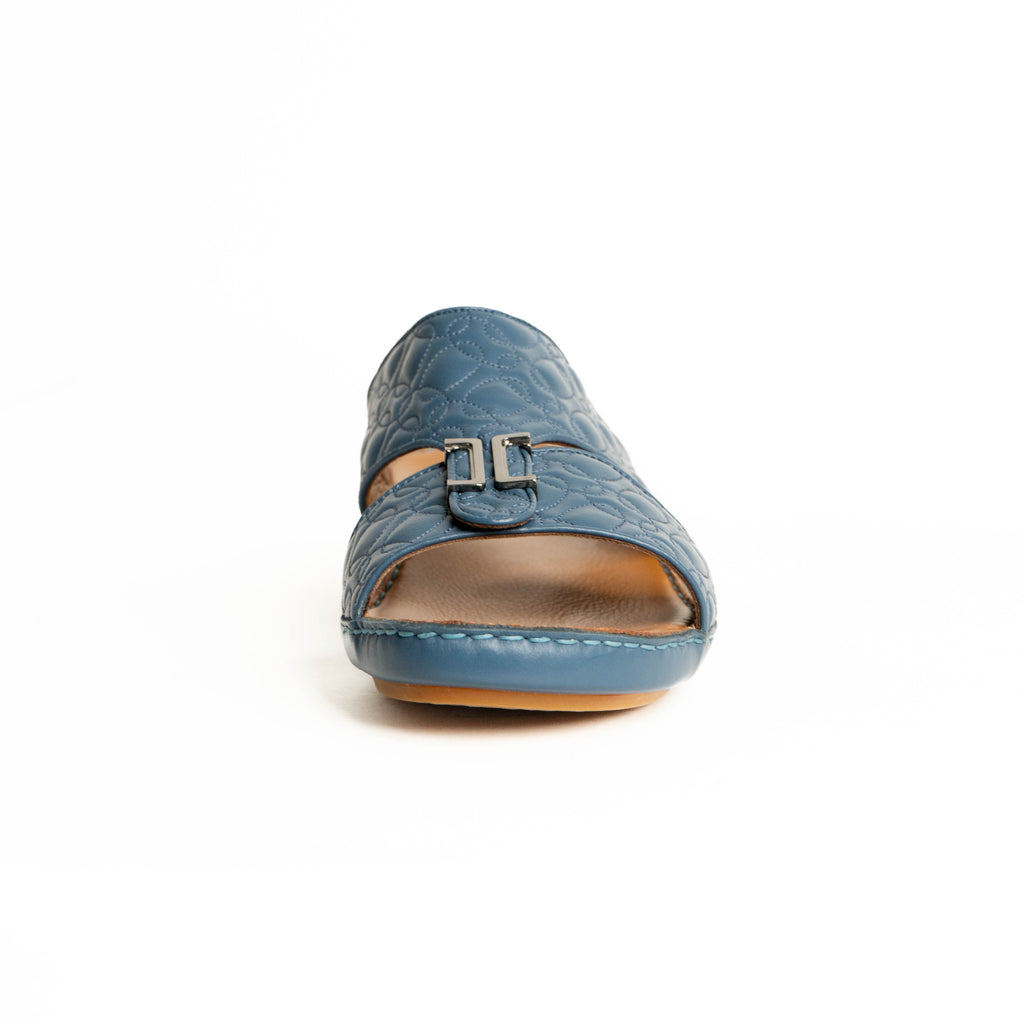 Blue sandal with a brown sole on a white background