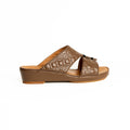 Brown sandal with patterned design on a white background