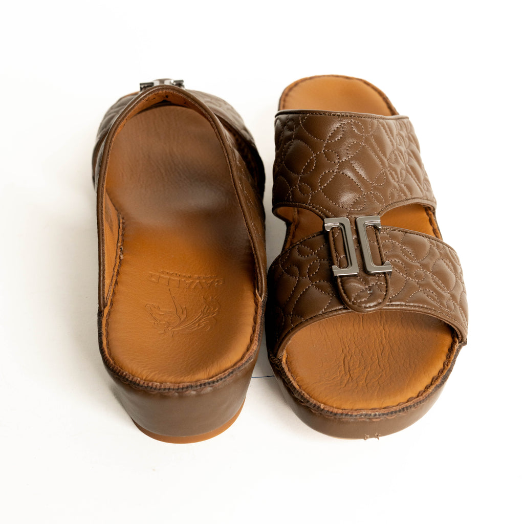 Pair of brown sandals with a buckle on a white background