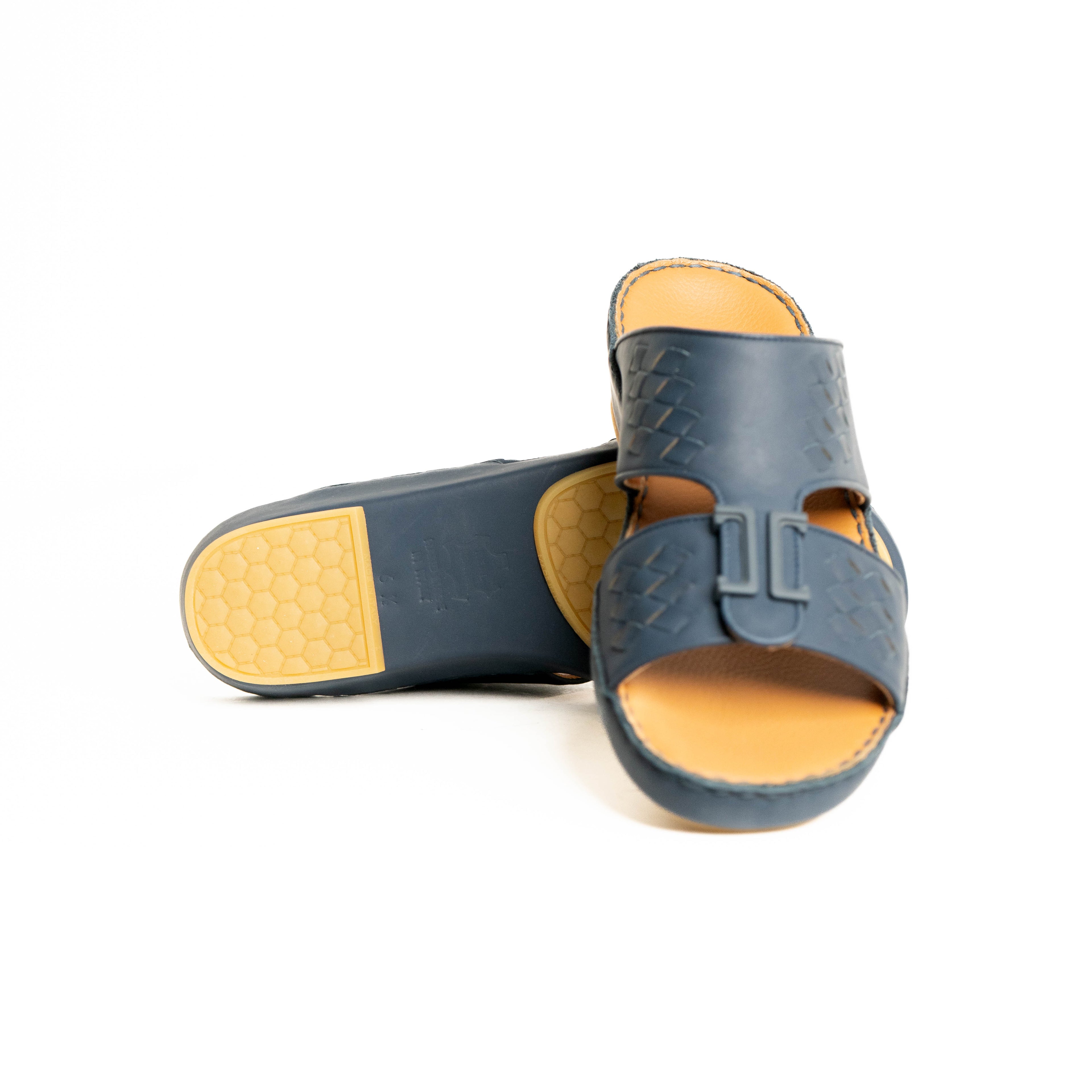 Pair of blue sandals with yellow soles on a white background