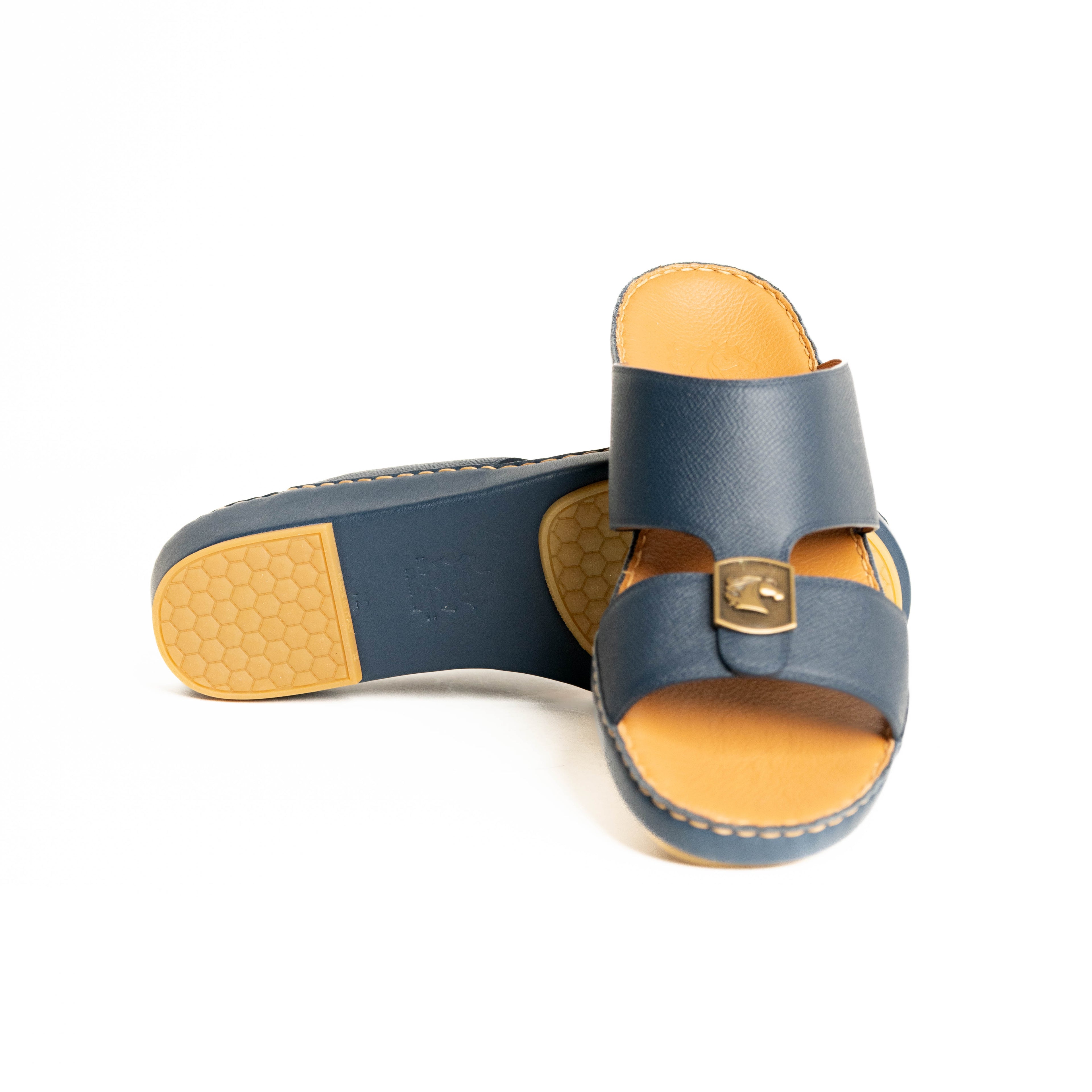Pair of blue sandals with yellow soles on a white background