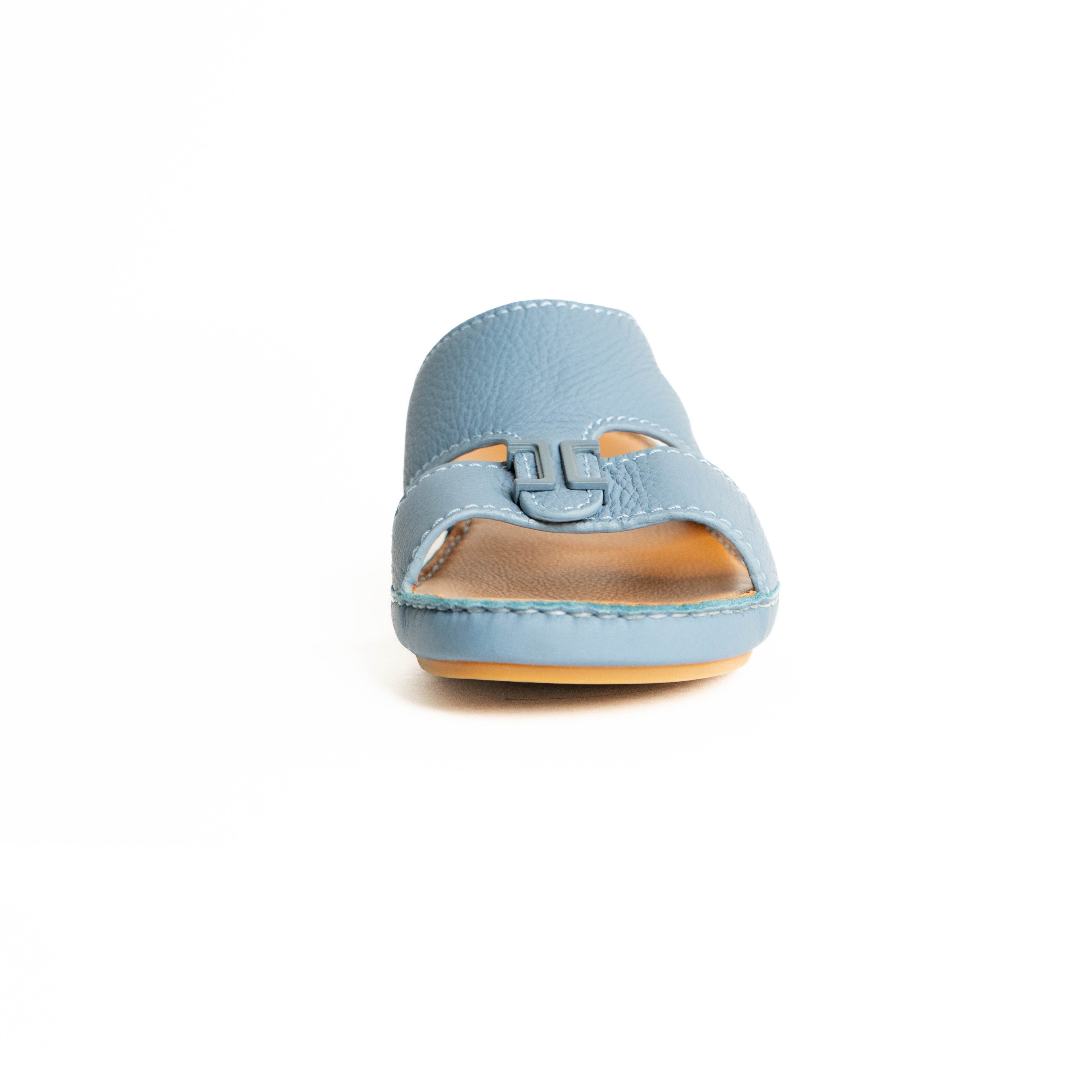 Light blue sandal with a brown sole on a white background