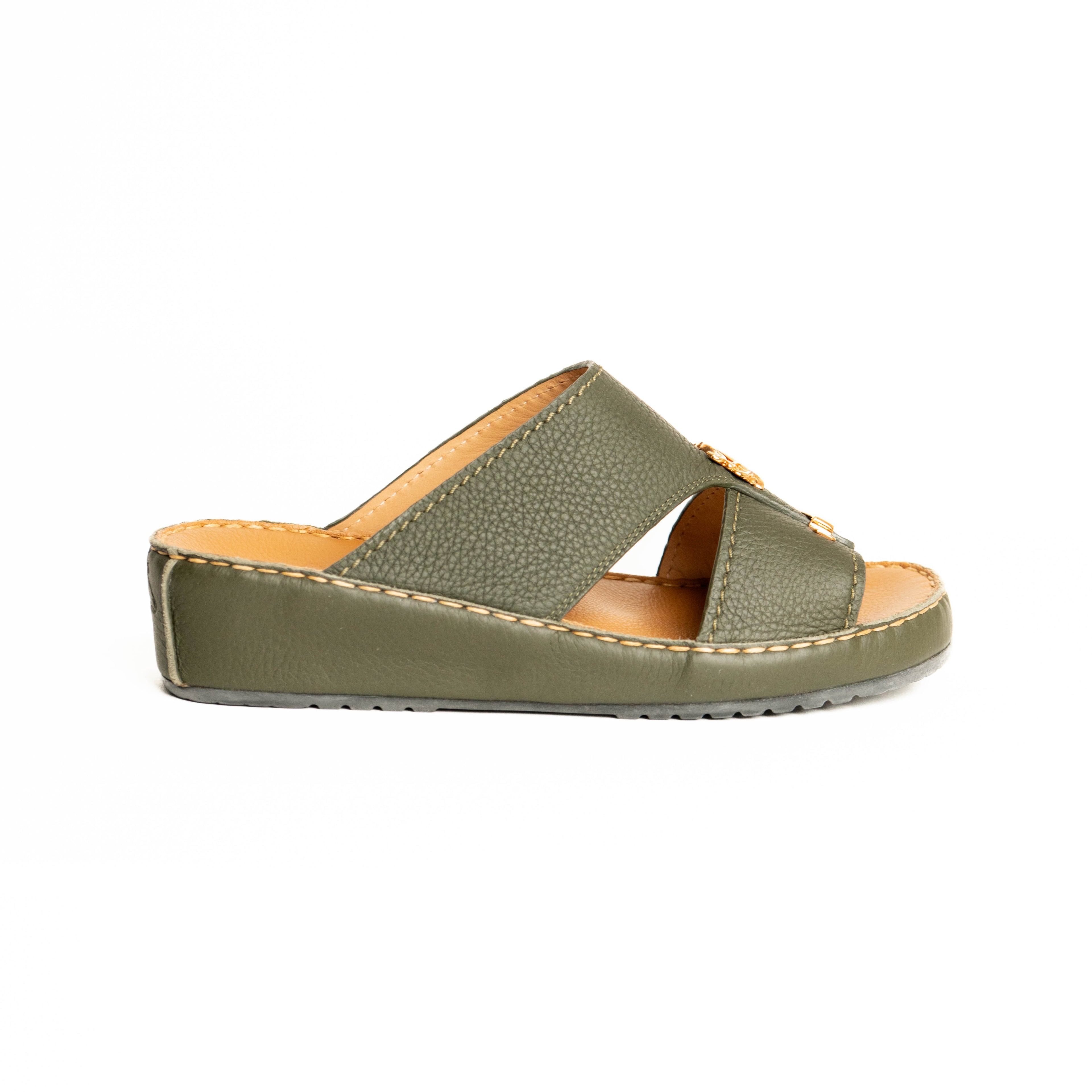 Green sandal with tan interior on a white background