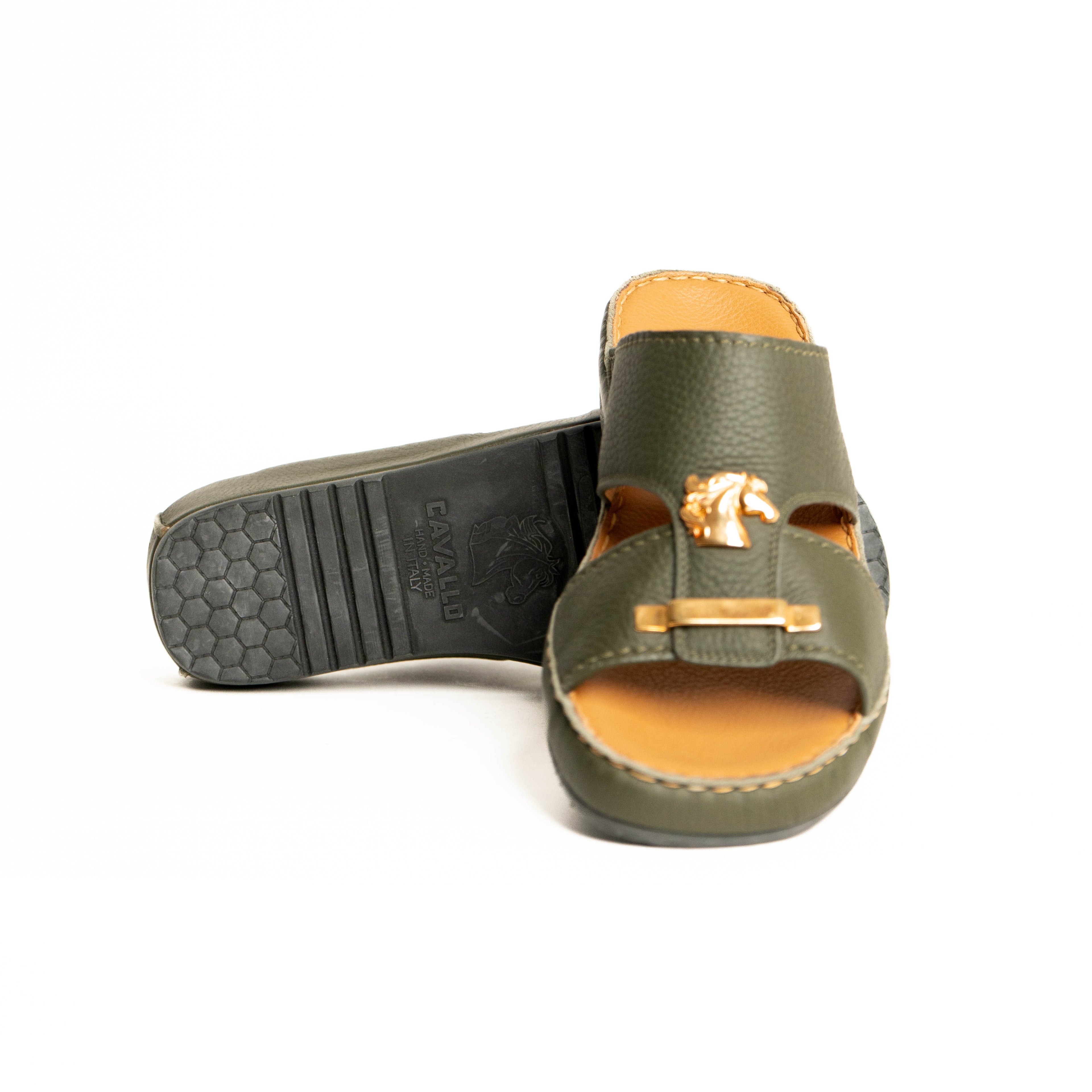 Green sandal with gold buckle on a white background