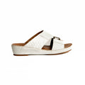 White sandal with brown sole on a white background