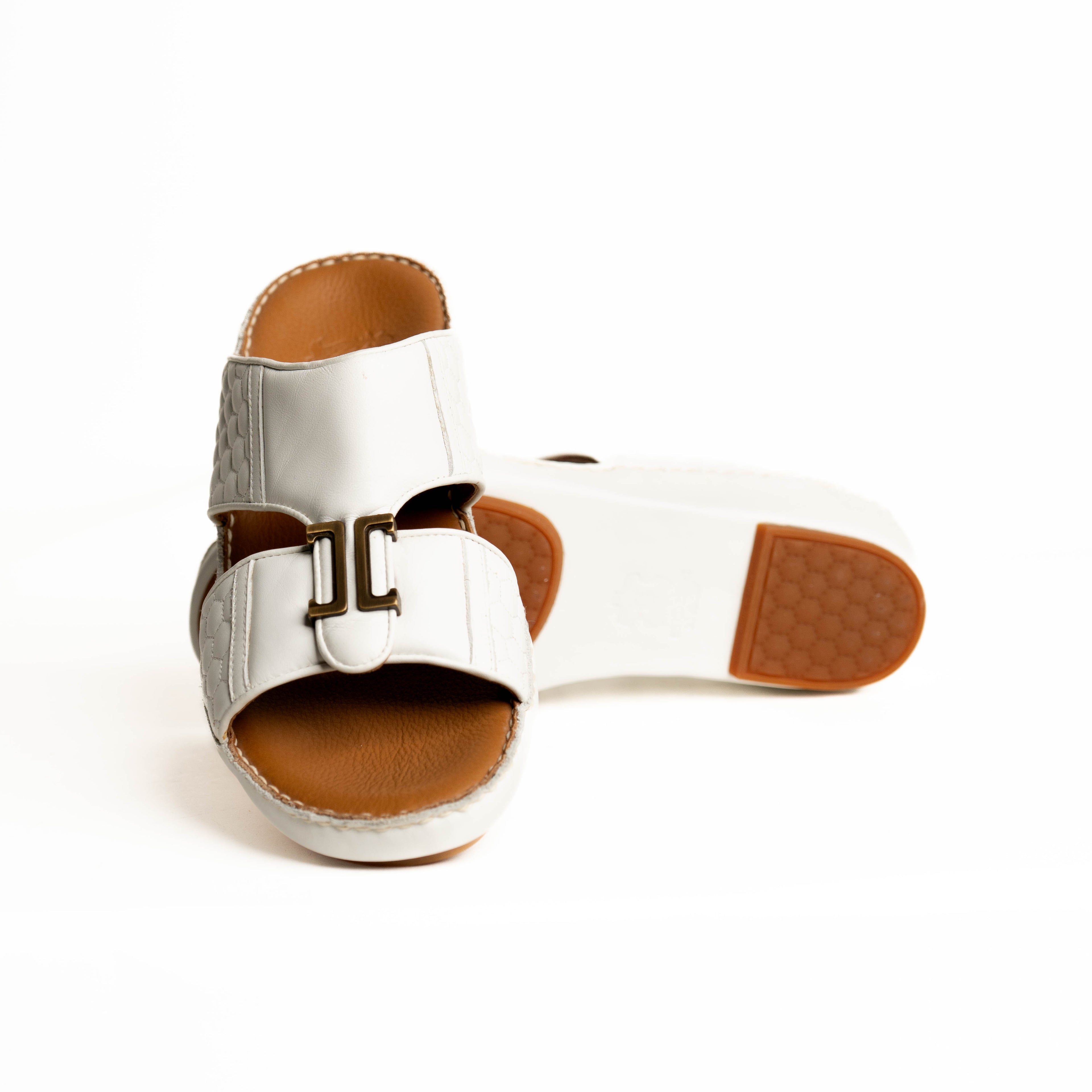 Silver sandal with brown sole on a white background