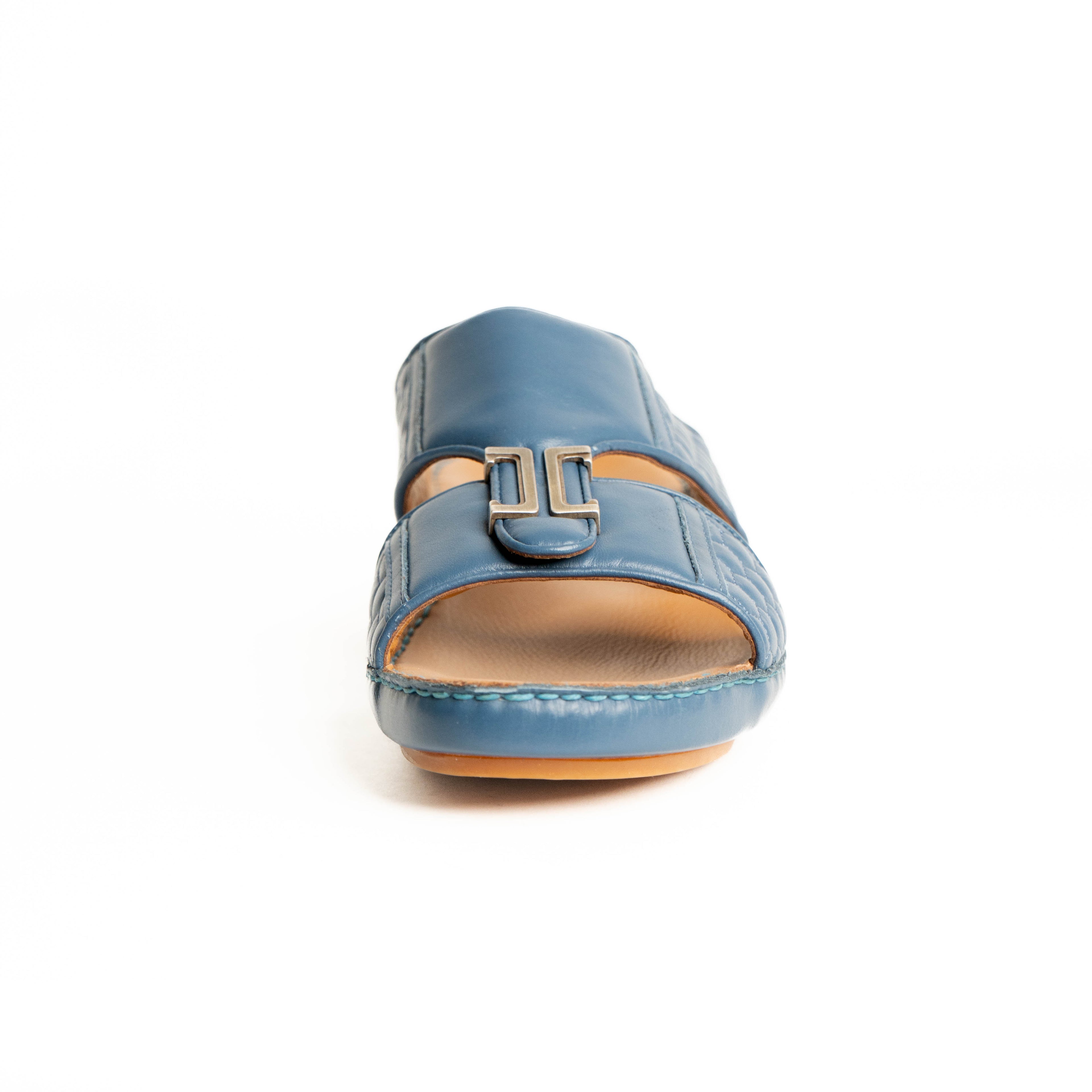 Blue sandal with a buckle on a white background
