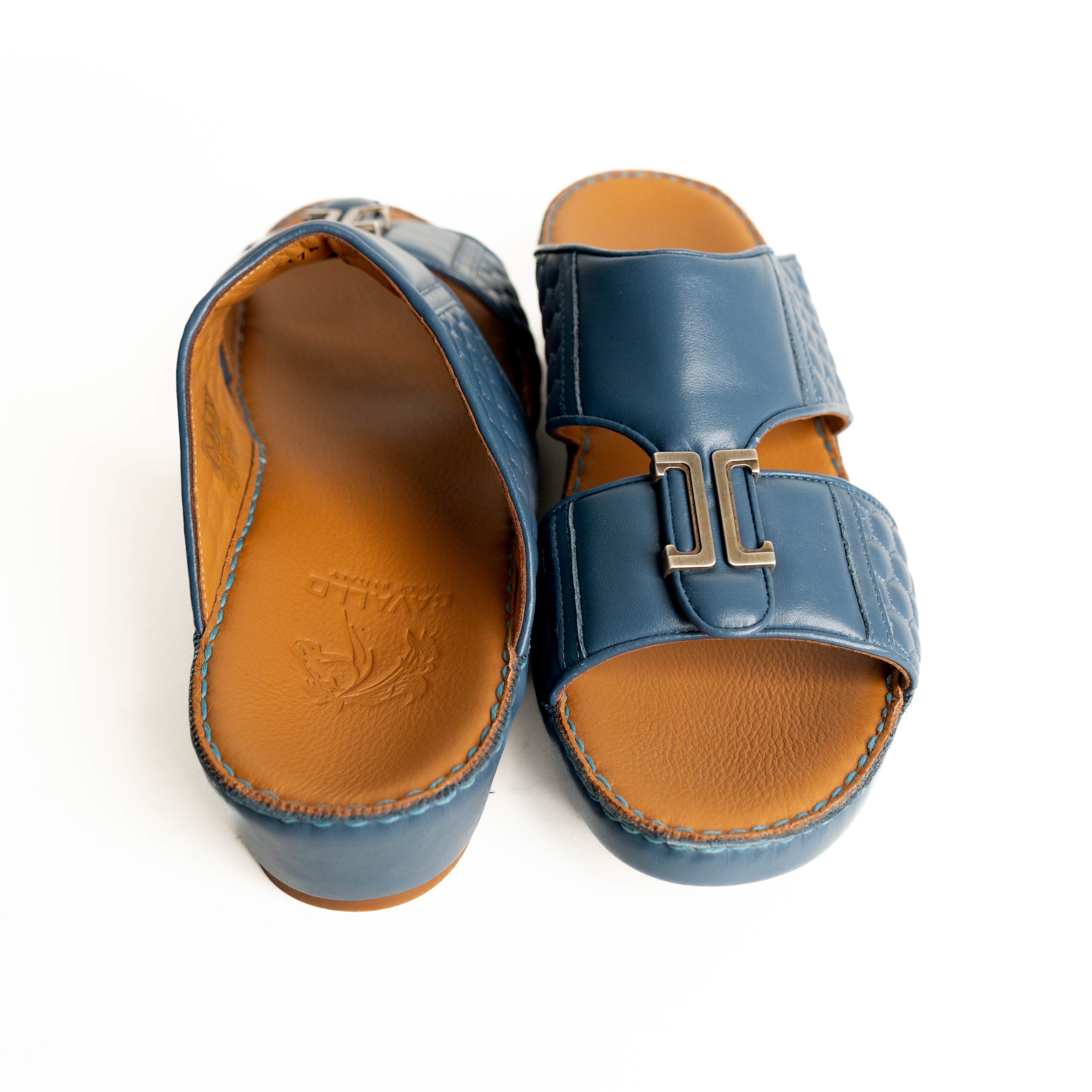 Blue sandals with brown soles on a white background
