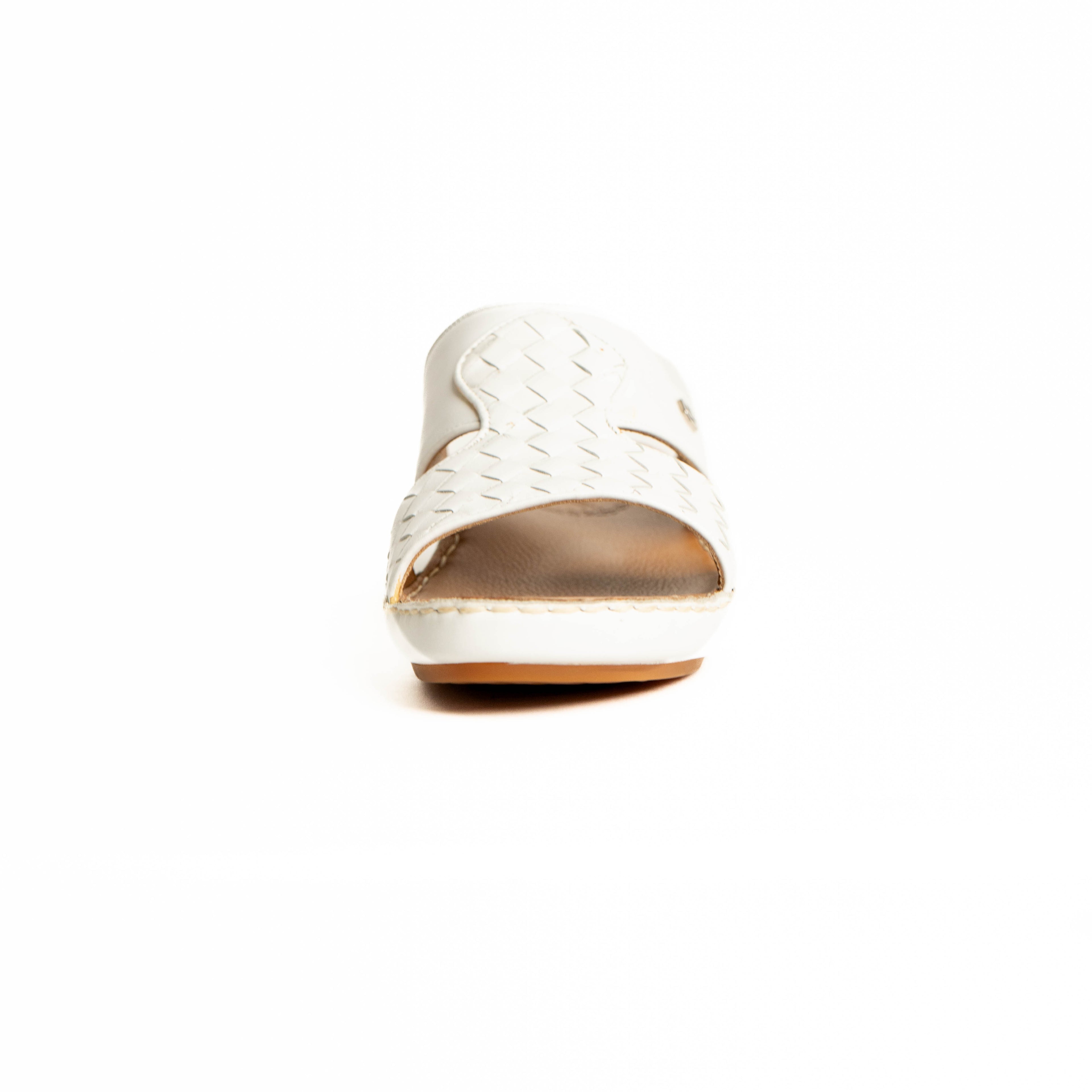 White sneaker with gold sole on a white background