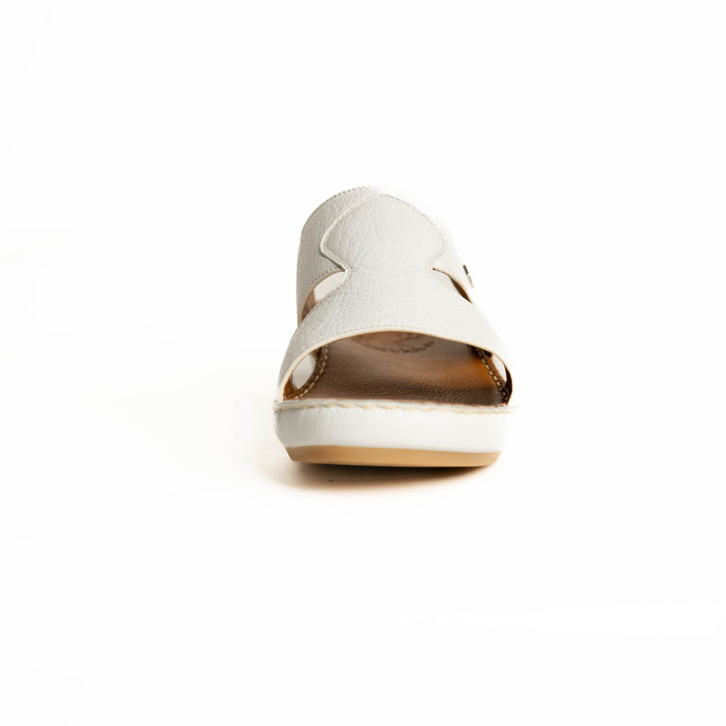 White shoe with brown sole on a white background