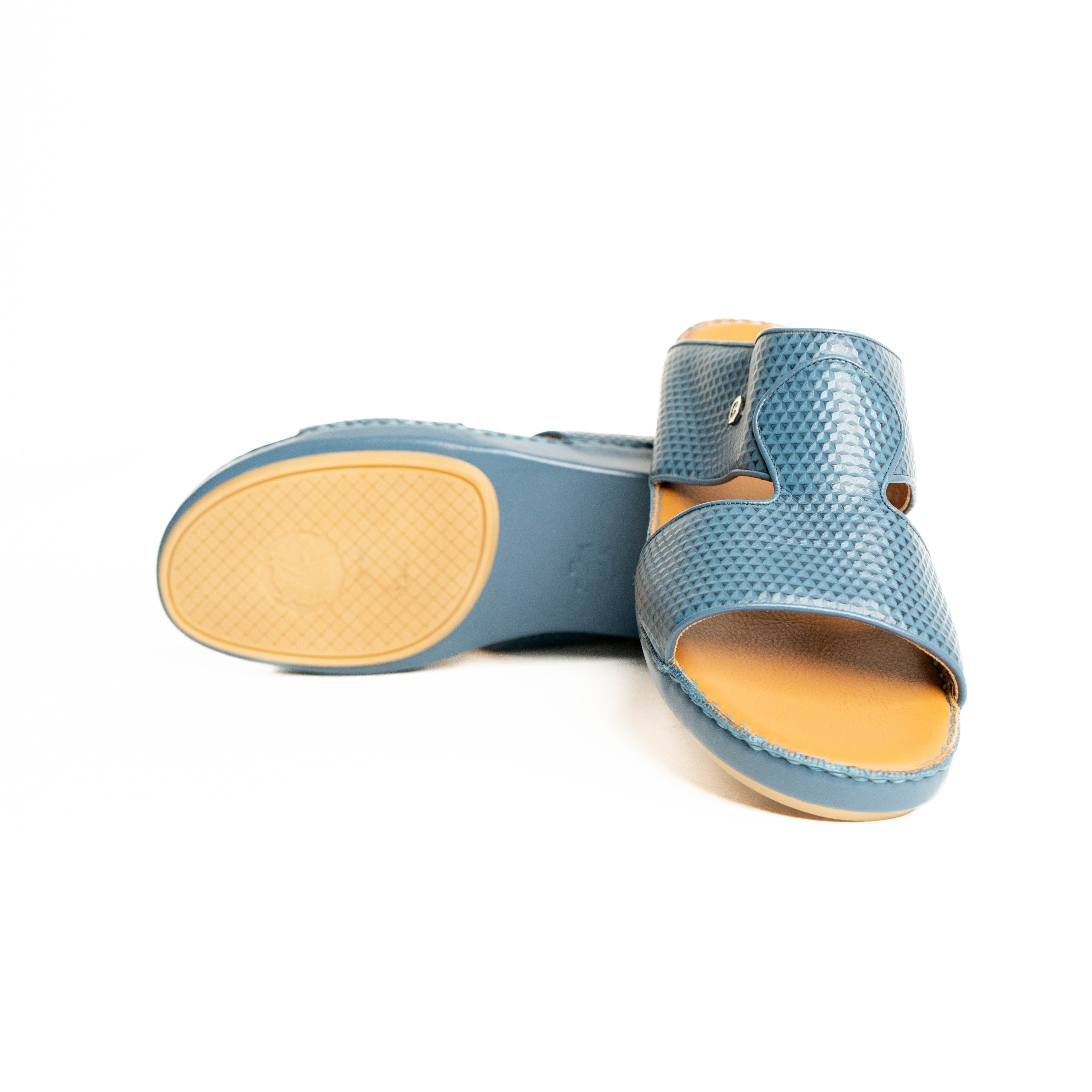 Blue sandal with yellow sole on a white background