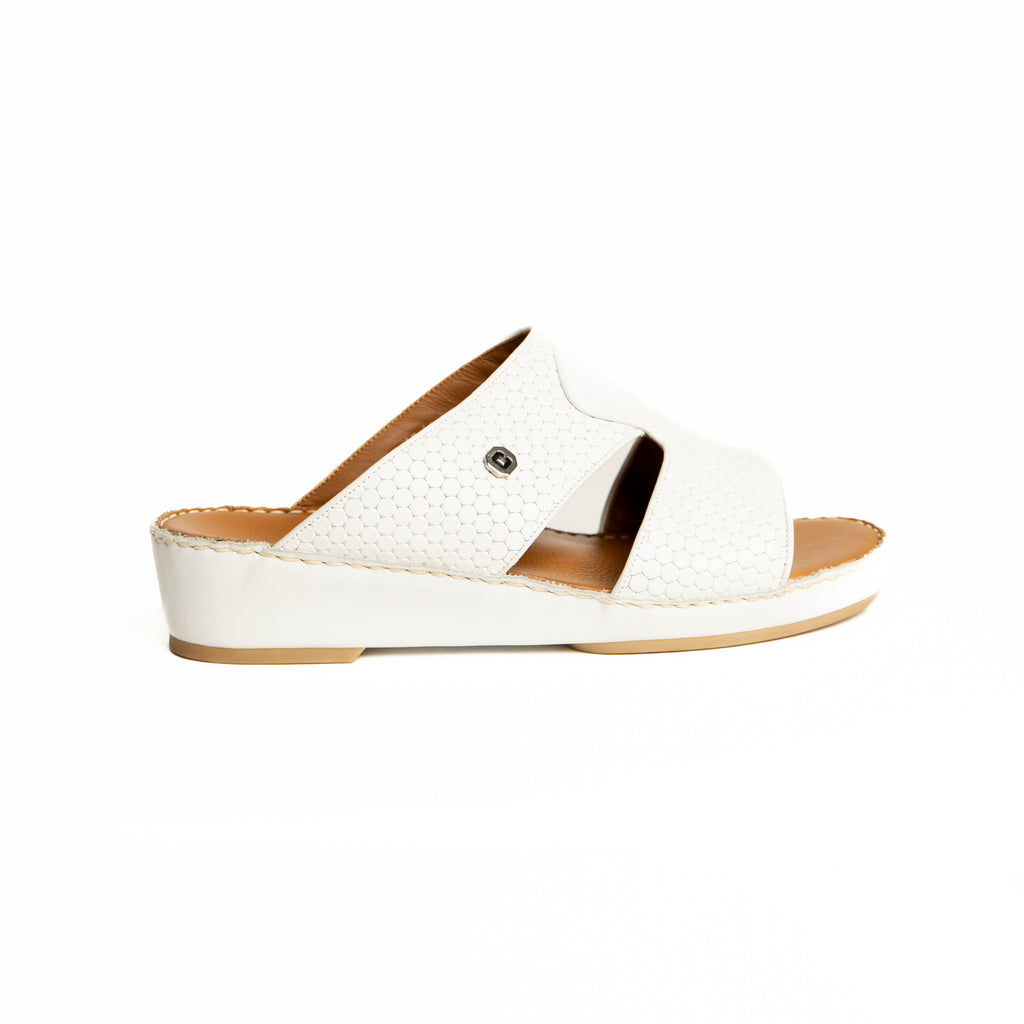 White sandal with brown sole on a white background