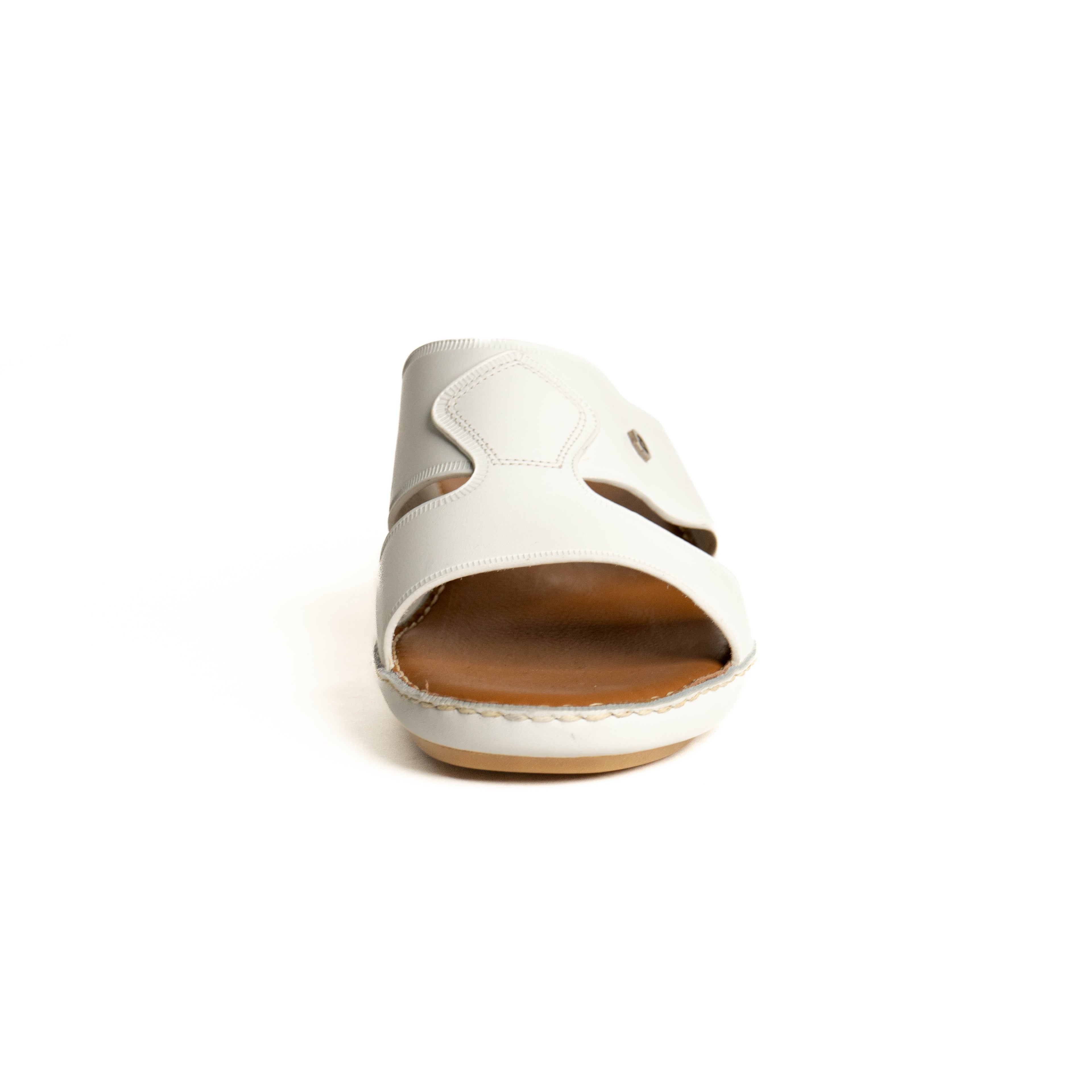 White sandal with a brown sole on a white background