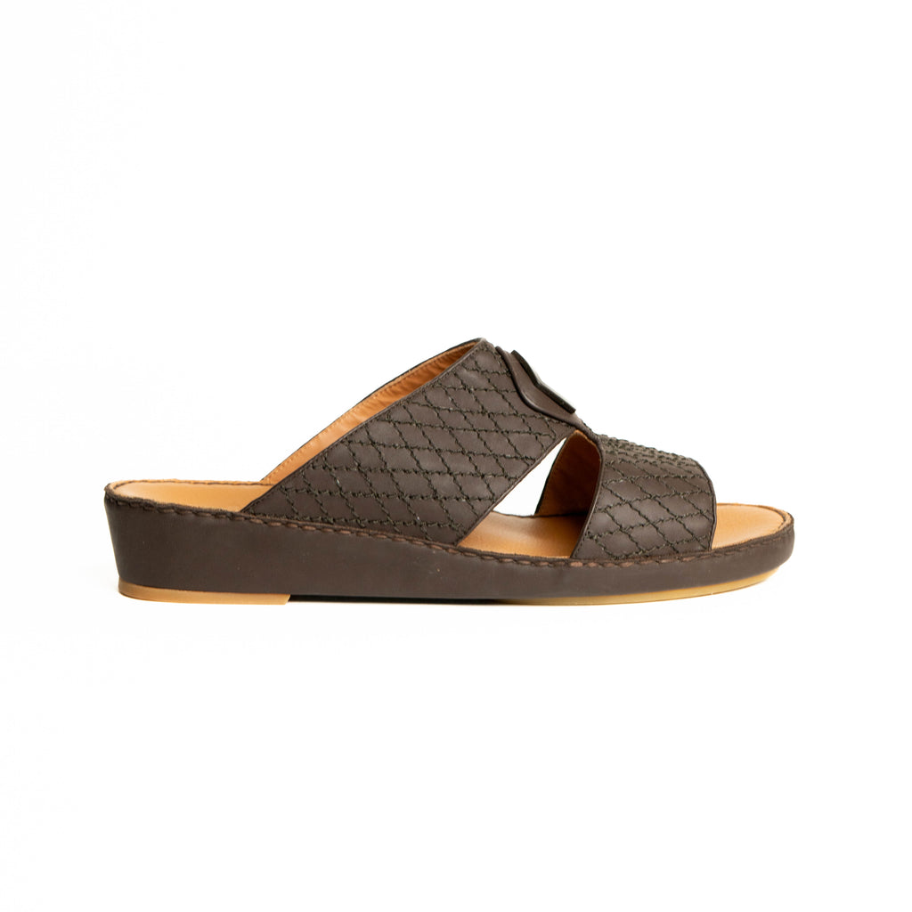 Brown sandal with woven pattern on a white background
