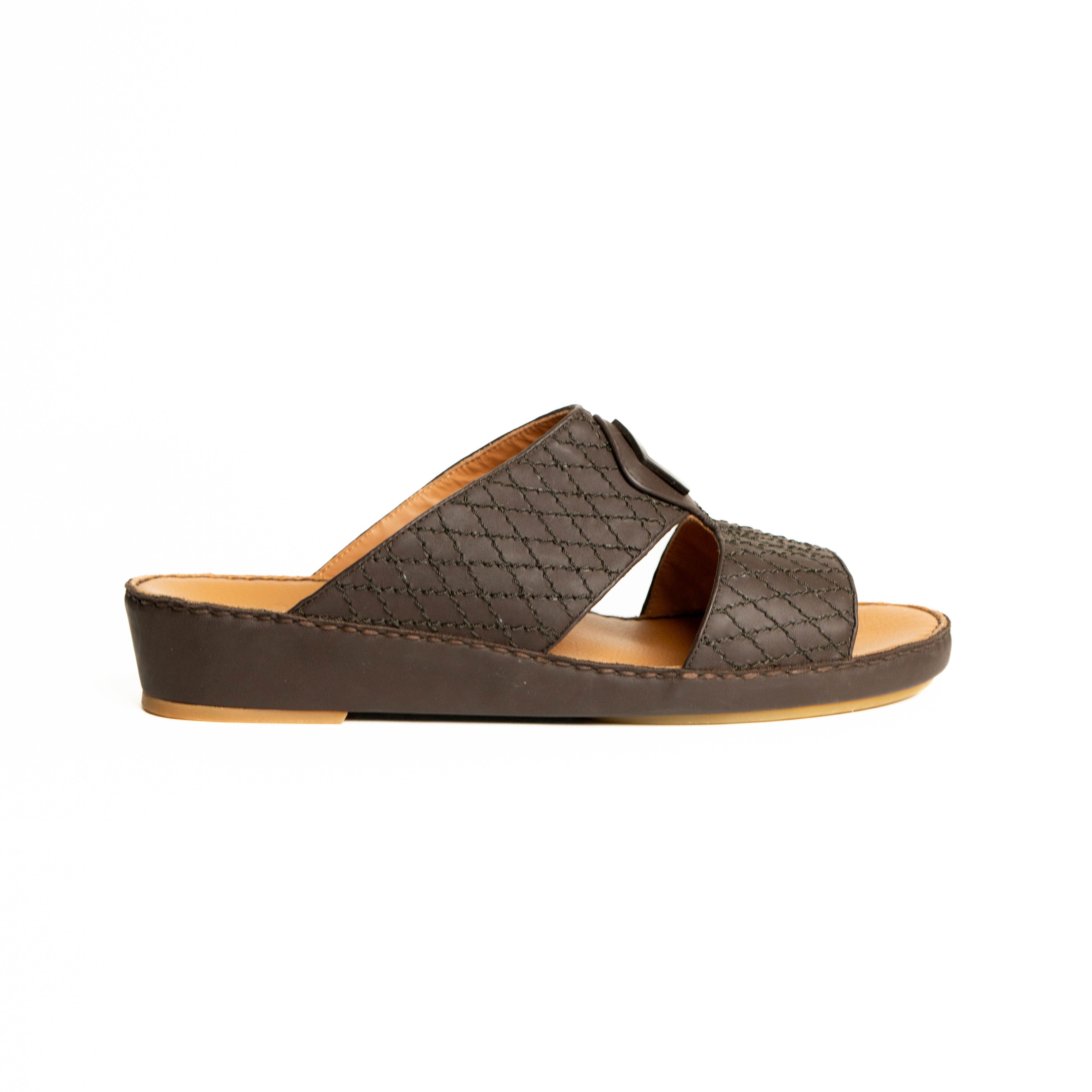 Brown sandal with woven pattern on a white background