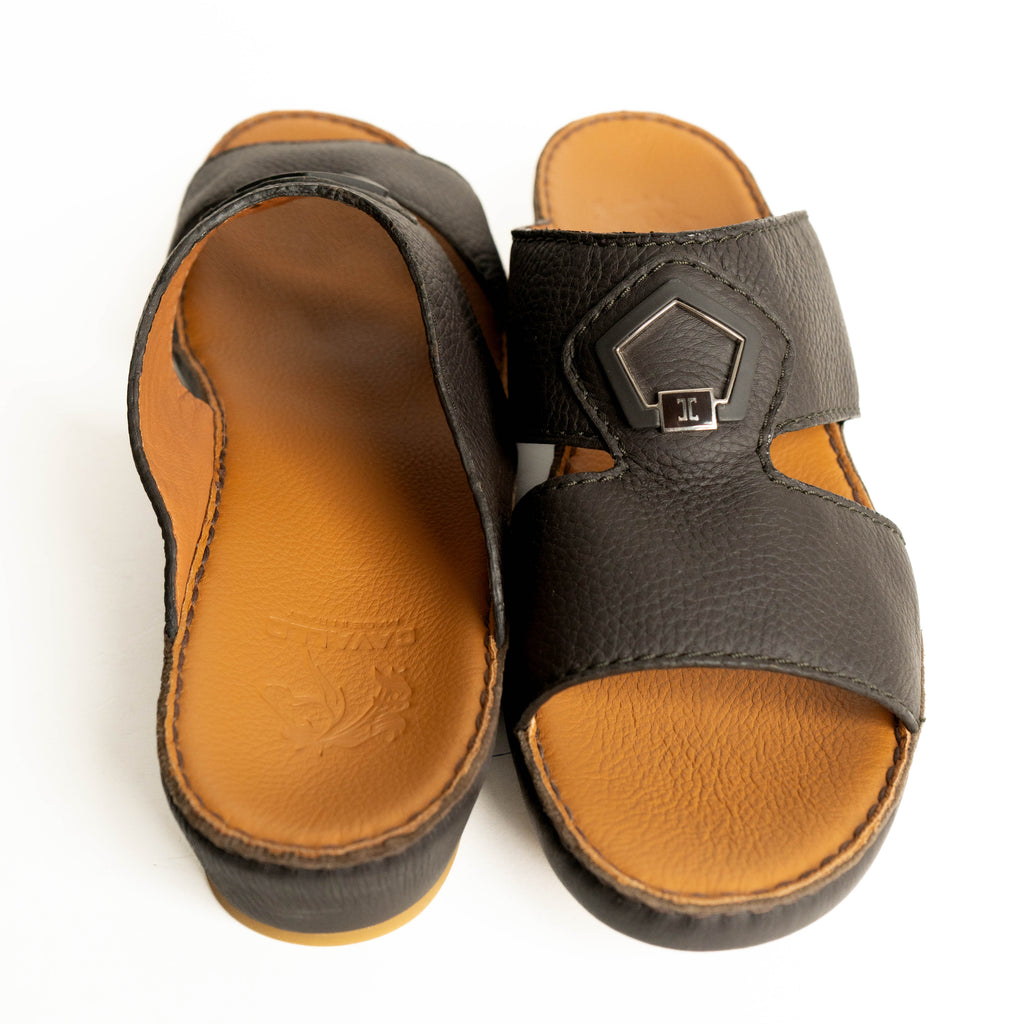 Pair of sandals with brown soles and gray straps on a white background