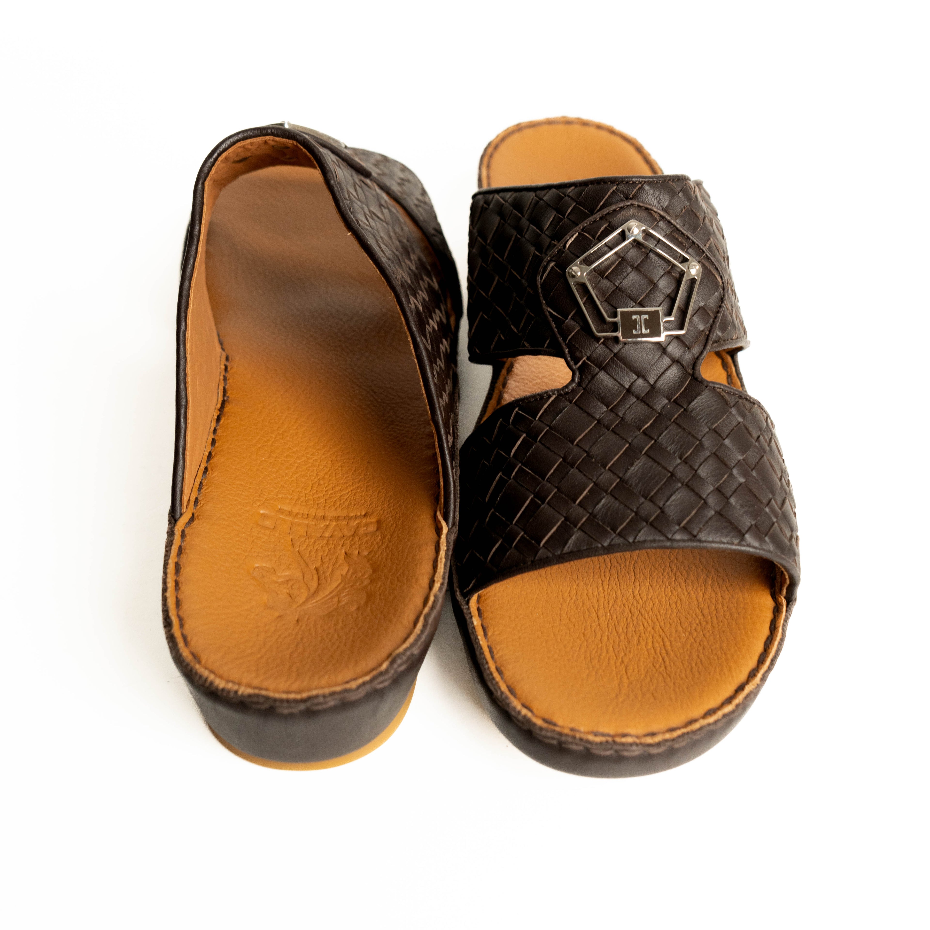 Pair of brown sandals with woven strap and buckle on a white background