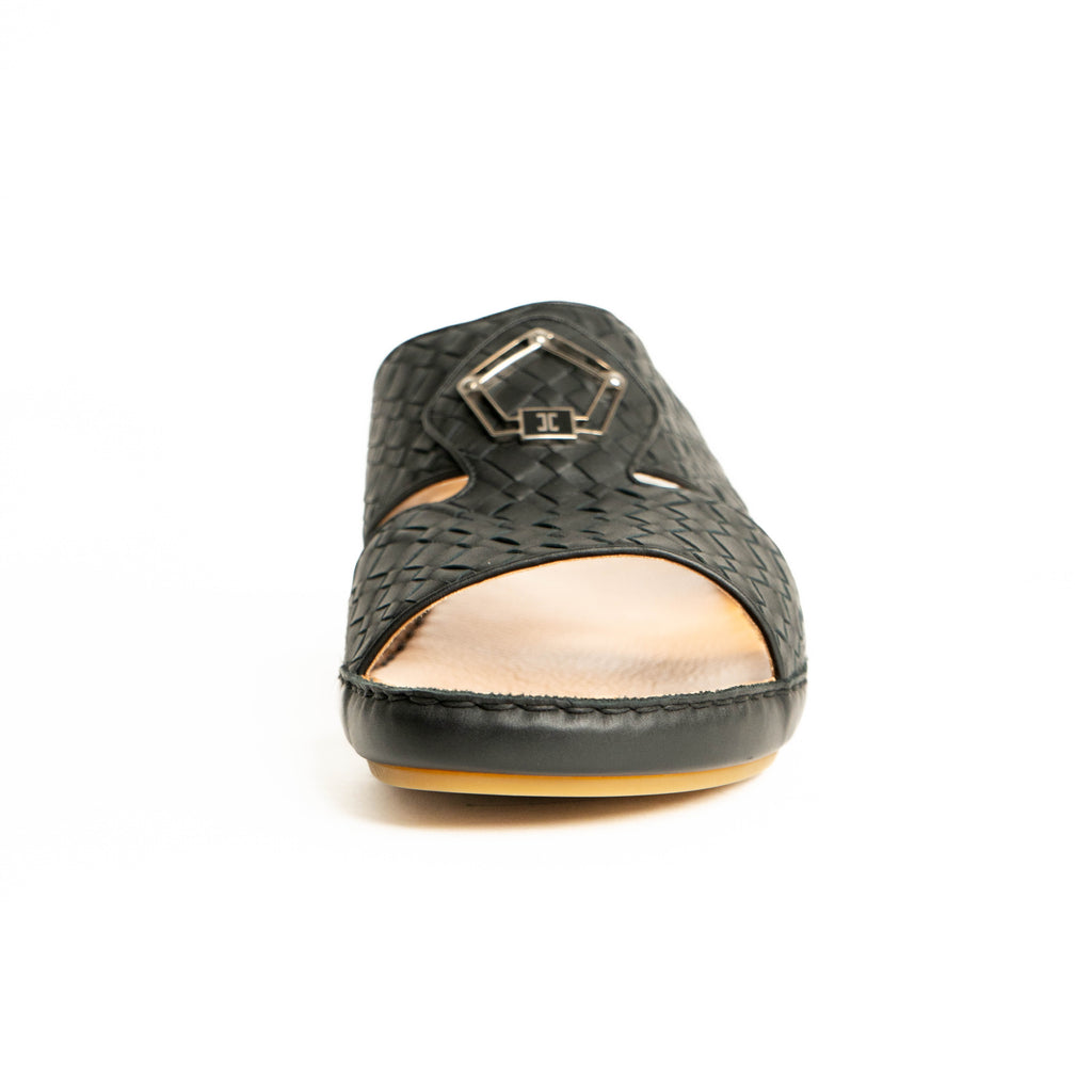 Black sandal with gold interior on a white background