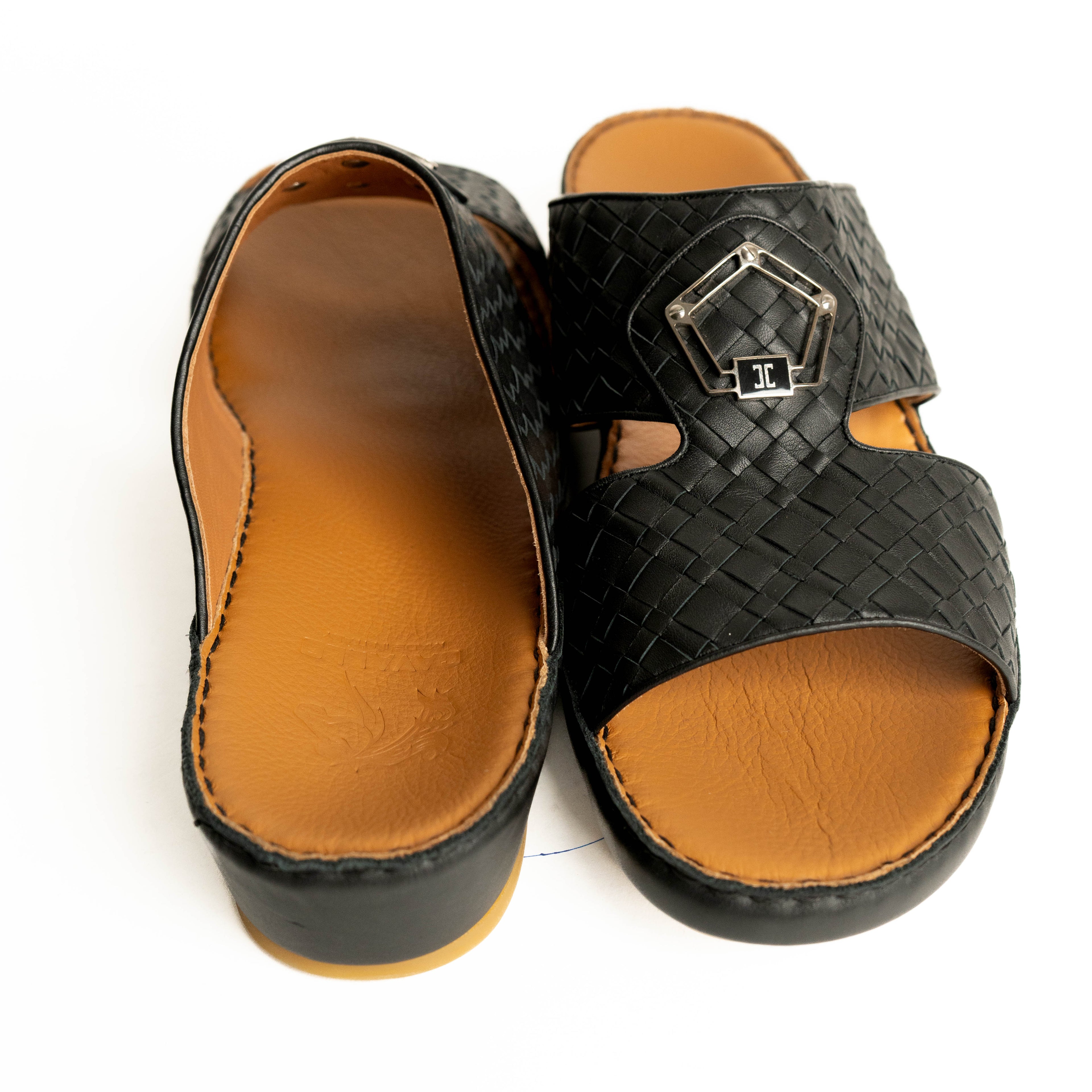 Black woven sandal with tan insole on a white background