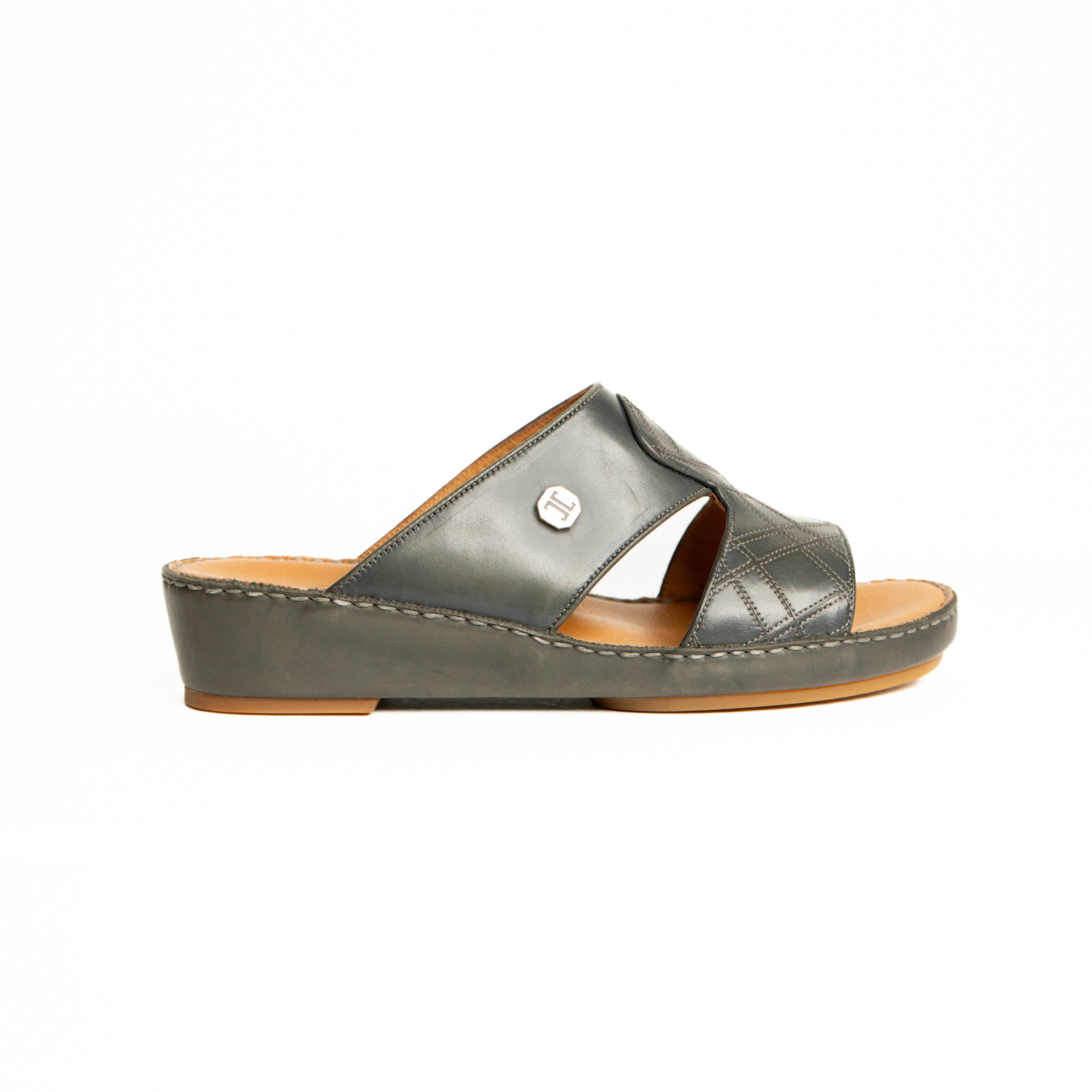 Gray sandal with a brown sole on a white background
