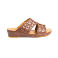 Brown sandal with quilted design on a white background