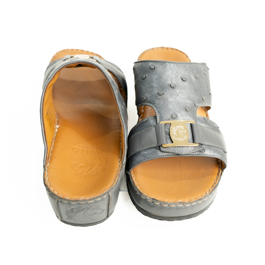 Pair of gray sandals with brown soles on a white background