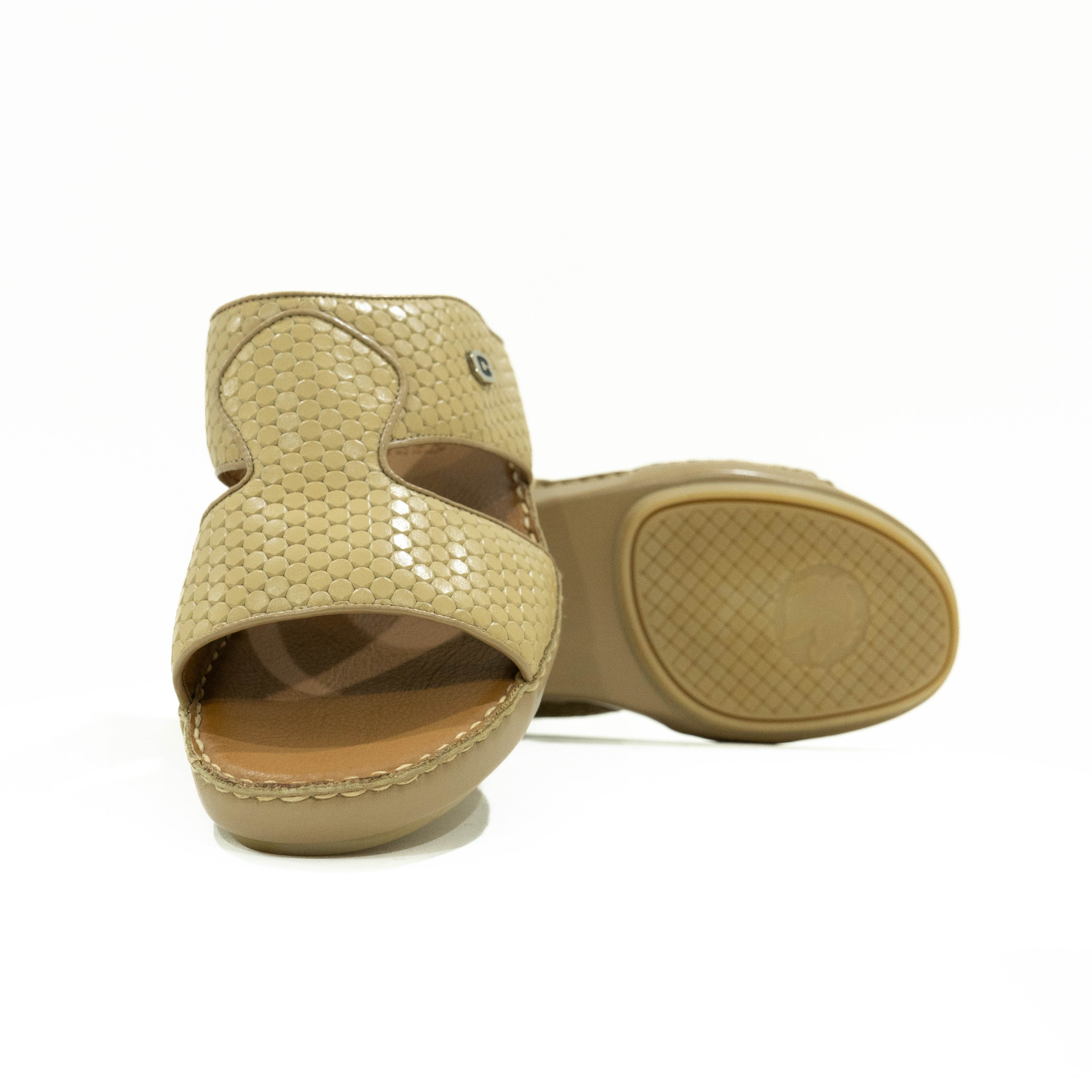 Beige sandal with open toe design on a white background